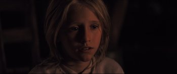 Movie still from “Seraphim Falls” (2006), directed by David Von Ancken – A young girl with long blonde hair; Close Up shot, Over the shoulder angle