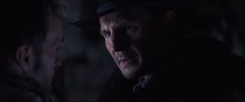 Movie still from “Seraphim Falls” (2006), directed by David Von Ancken – A person wearing a hat; Close Up shot, Over the shoulder angle