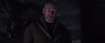 Movie still from “Seraphim Falls” (2006), directed by David Von Ancken – A man with a beard wearing a brown jacket; Close Up shot, Low angle