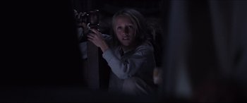 Movie still from “Seraphim Falls” (2006), directed by David Von Ancken – A young girl holding onto a wooden post; Medium shot, Low angle