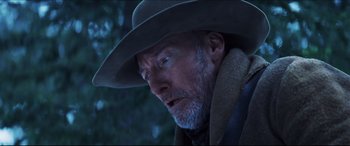 Movie still from “Seraphim Falls” (2006), directed by David Von Ancken – An old man with a hat and a beard looking to his left; Close Up shot, Low angle
