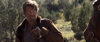 Movie still from “Seraphim Falls” (2006), directed by David Von Ancken – A person holding a camera; Medium shot, Low angle