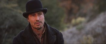 Movie still from “Seraphim Falls” (2006), directed by David Von Ancken – A person wearing a hat; Close Up shot, Low angle