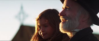 Movie still from “Seraphim Falls” (2006), directed by David Von Ancken – A girl and an older man looking at each other; Close Up shot, Over the shoulder angle