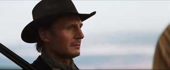 Movie still from “Seraphim Falls” (2006), directed by David Von Ancken – A person wearing a cowboy hat; Close Up shot, Low angle