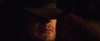 Movie still from “Seraphim Falls” (2006), directed by David Von Ancken – A man wearing a cowboy hat; Extreme Close Up shot, Low angle