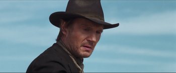 Movie still from “Seraphim Falls” (2006), directed by David Von Ancken – A person wearing a hat; Close Up shot, Low angle