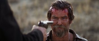 Movie still from “Seraphim Falls” (2006), directed by David Von Ancken – A person holding a knife; Close Up shot, Over the shoulder angle