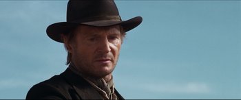 Movie still from “Seraphim Falls” (2006), directed by David Von Ancken – A person wearing a hat; Close Up shot, Low angle