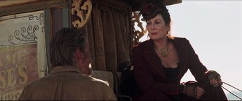 Movie still from “Seraphim Falls” (2006), directed by David Von Ancken – An older man and woman sitting in a carriage; Medium shot, Over the shoulder angle