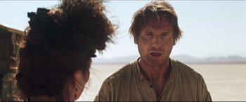 Movie still from “Seraphim Falls” (2006), directed by David Von Ancken – A man and a woman are looking at each other; Close Up shot, Over the shoulder angle