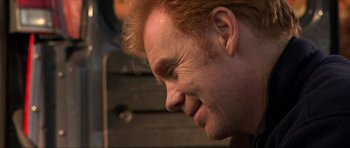 Movie still from “Session 9” (2001), directed by Brad Anderson – A man's face with red hair; Close Up shot, High angle