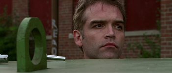 Movie still from “Session 9” (2001), directed by Brad Anderson – A person looking at the camera; Close Up shot, Low angle