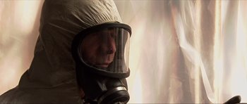 Movie still from “Session 9” (2001), directed by Brad Anderson – A man wearing a gas mask in a room; Close Up shot, Low angle
