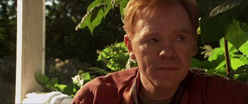 Movie still from “Session 9” (2001), directed by Brad Anderson – A person wearing a jacket; Close Up shot, Over the shoulder angle