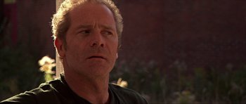 Movie still from “Session 9” (2001), directed by Brad Anderson – A person looking at the camera; Close Up shot, Low angle