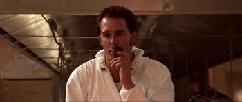 Movie still from “Session 9” (2001), directed by Brad Anderson – A man sitting down while smoking a cigarette; Close Up shot, Low angle