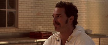 Movie still from “Session 9” (2001), directed by Brad Anderson – A person with a mustache; Close Up shot, Over the shoulder angle