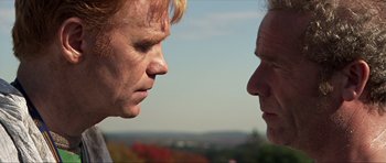 Movie still from “Session 9” (2001), directed by Brad Anderson – Two men face each other in a close up view; Close Up shot, Over the shoulder angle