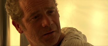 Movie still from “Session 9” (2001), directed by Brad Anderson – A man's face in the sunlight; Close Up shot, Low angle