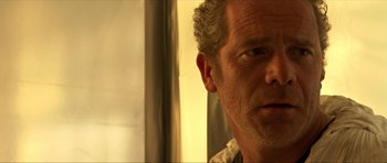 Movie still from “Session 9” (2001), directed by Brad Anderson – A person with a beard; Close Up shot, Over the shoulder angle