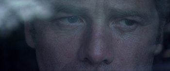 Movie still from “Session 9” (2001), directed by Brad Anderson – A man's eyes and face; Extreme Close Up shot, Over the shoulder angle