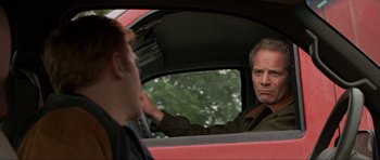 Movie still from “Session 9” (2001), directed by Brad Anderson – A man and a woman in a car looking at each other; Close Up shot, Over the shoulder angle