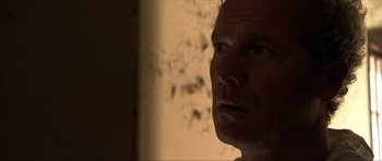 Movie still from “Session 9” (2001), directed by Brad Anderson – A person looking at the camera; Close Up shot, Over the shoulder angle