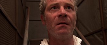 Movie still from “Session 9” (2001), directed by Brad Anderson – A person looking up at the sky; Close Up shot, Low angle