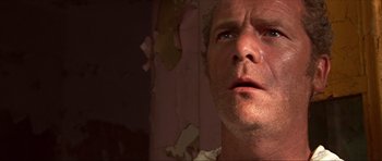 Movie still from “Session 9” (2001), directed by Brad Anderson – A man's face in a room with peeling paint; Close Up shot, Low angle