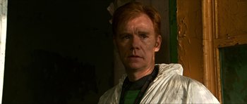 Movie still from “Session 9” (2001), directed by Brad Anderson – A person with red hair; Close Up shot, Over the shoulder angle