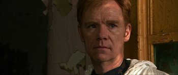 Movie still from “Session 9” (2001), directed by Brad Anderson – A person wearing a uniform; Close Up shot, Over the shoulder angle