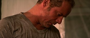 Movie still from “Session 9” (2001), directed by Brad Anderson – A man's face and neck; Close Up shot, Over the shoulder angle