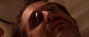 Movie still from “Session 9” (2001), directed by Brad Anderson – A man's face with a cigarette in it's mouth; Extreme Close Up shot, Overhead angle