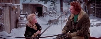 Movie still from “Seven Brides for Seven Brothers” (1954), directed by Stanley Donen – A man and a woman in the snow; Medium shot, Over the shoulder angle