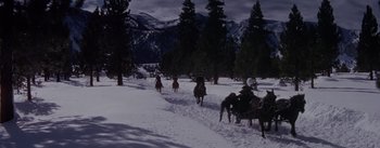 Movie still from “Seven Brides for Seven Brothers” (1954), directed by Stanley Donen – A group of people riding horses in the snow; Extreme Wide shot, High angle