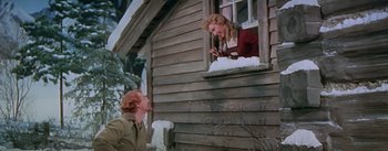 Movie still from “Seven Brides for Seven Brothers” (1954), directed by Stanley Donen – A man and a woman looking out of a window; Medium shot, Low angle