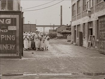 Movie still from “Seven Chances” (1925), directed by Buster Keaton – A group of people standing on a sidewalk; Extreme Wide shot, High angle