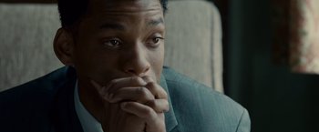Movie still from “Seven Pounds” (2008), directed by Gabriele Muccino – A person with his hands near his face; Close Up shot, Over the shoulder angle