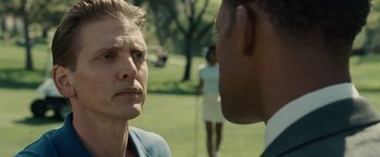 Movie still from “Seven Pounds” (2008), directed by Gabriele Muccino – Two people in a park talking to each other; Close Up shot, Over the shoulder angle