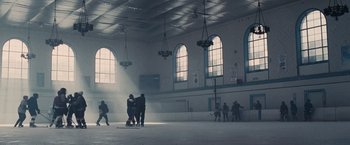 Movie still from “Seven Pounds” (2008), directed by Gabriele Muccino – A group of people standing inside of a building; Extreme Wide shot, Low angle
