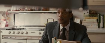Movie still from “Seven Pounds” (2008), directed by Gabriele Muccino – A person wearing a suit and tie; Close Up shot, Over the shoulder angle
