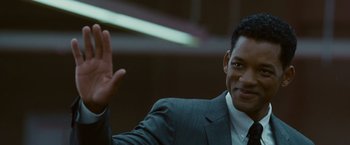 Movie still from “Seven Pounds” (2008), directed by Gabriele Muccino – A person wearing a suit and tie; Close Up shot, Over the shoulder angle