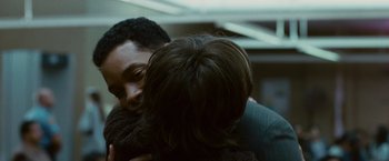 Movie still from “Seven Pounds” (2008), directed by Gabriele Muccino – Two people hugging each other in a dark room; Close Up shot, Over the shoulder angle