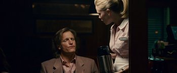 Movie still from “Seven Pounds” (2008), directed by Gabriele Muccino – A man and a woman are talking to each other; Medium shot, Over the shoulder angle