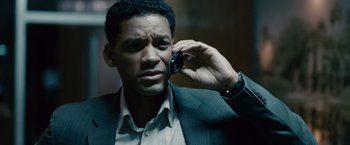 Movie still from “Seven Pounds” (2008), directed by Gabriele Muccino – A person talking on a cell phone; Close Up shot, High angle