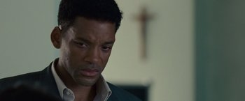 Movie still from “Seven Pounds” (2008), directed by Gabriele Muccino – A person wearing a shirt and tie; Close Up shot, Over the shoulder angle