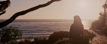 Movie still from “Seven Pounds” (2008), directed by Gabriele Muccino – A man standing on a cliff looking out at the ocean; Extreme Wide shot, Over the shoulder angle