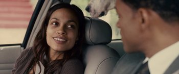 Movie still from “Seven Pounds” (2008), directed by Gabriele Muccino – A woman sitting in the back of a car with a man; Close Up shot, Over the shoulder angle