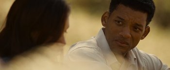 Movie still from “Seven Pounds” (2008), directed by Gabriele Muccino – A man and a woman are sitting in front of each other; Close Up shot, Over the shoulder angle